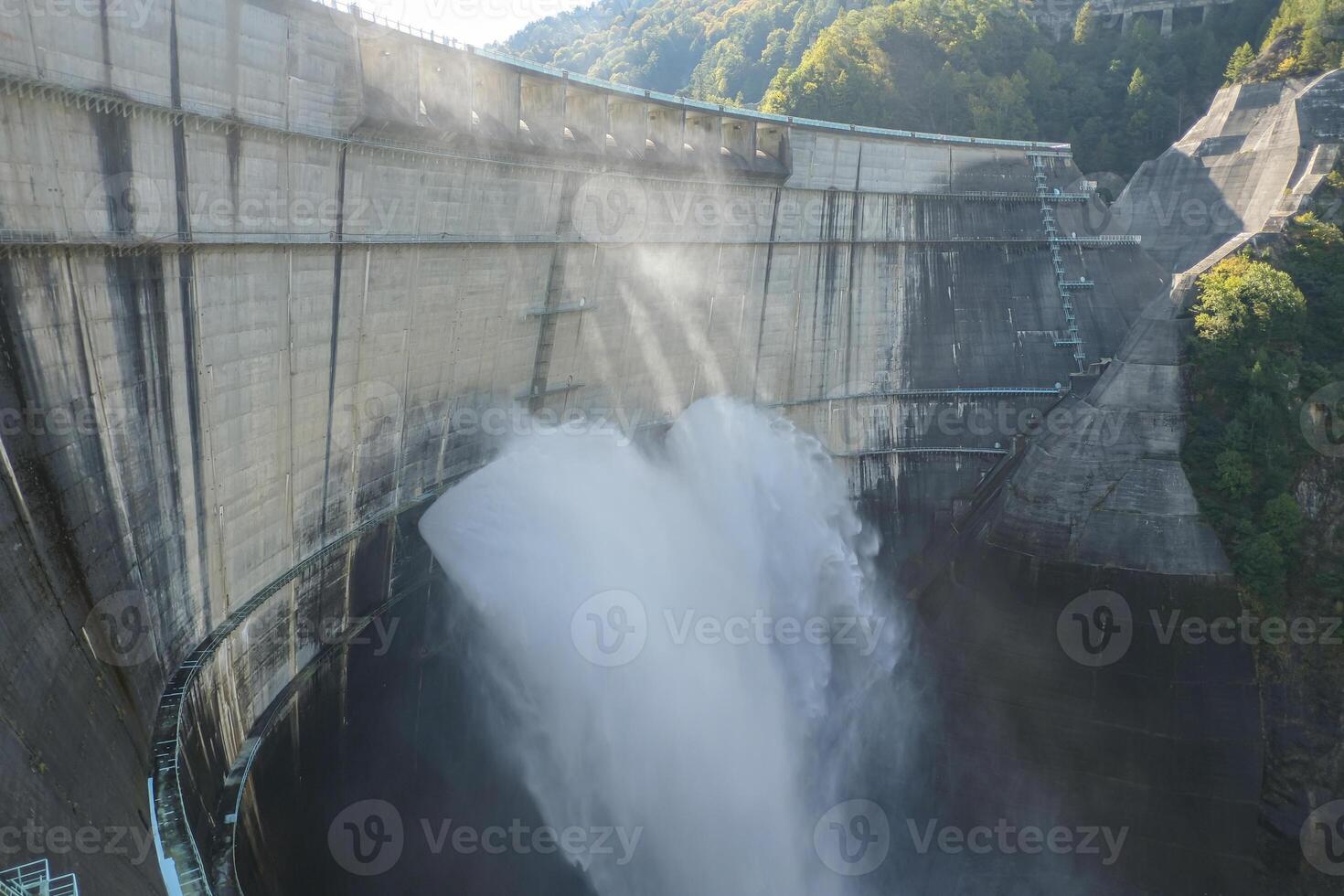 Kurobe Dam, Tateyama, Toyama, Chubu, Japan A dam discharges water forcefully photo