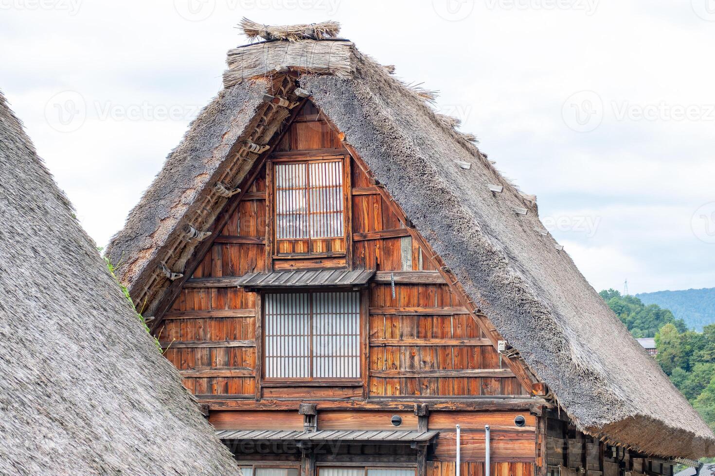 Shirakawa village, Gifu, Japan. Traditional wooden house with a thatched roof photo