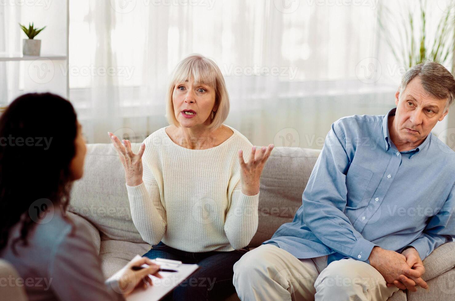 Marriage Therapist. Senoir woman complaining about her mature husband to female psychiatrist, copyspace photo
