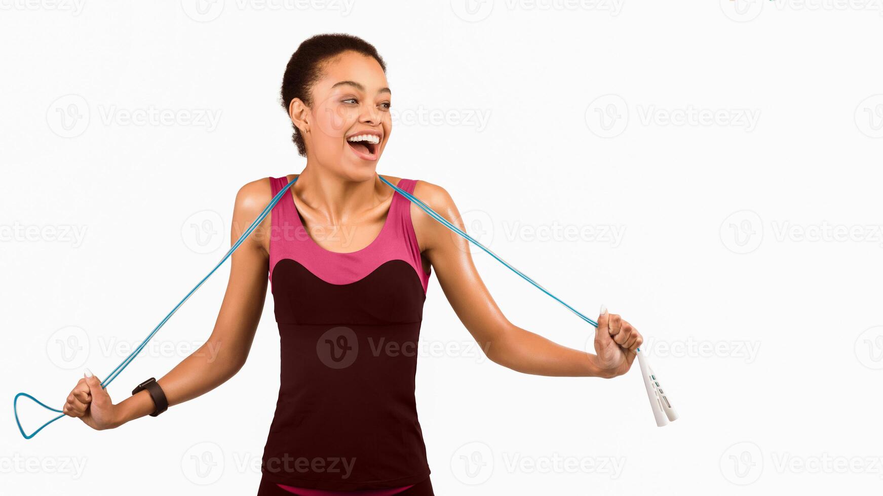 Weight Loss. Happy Black Girl Holding Jump Rope Exercising Over White Studio Background. Panorama, Copy Space photo
