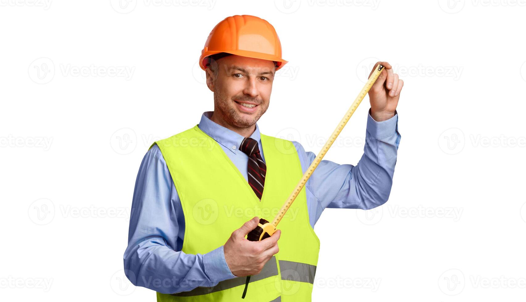 Builder Worker Holding Measuring Tape Tool Smiling To Camera Posing Standing Over White Studio Background, Wearing Uniform. Construction Regulations, Building House Concept photo