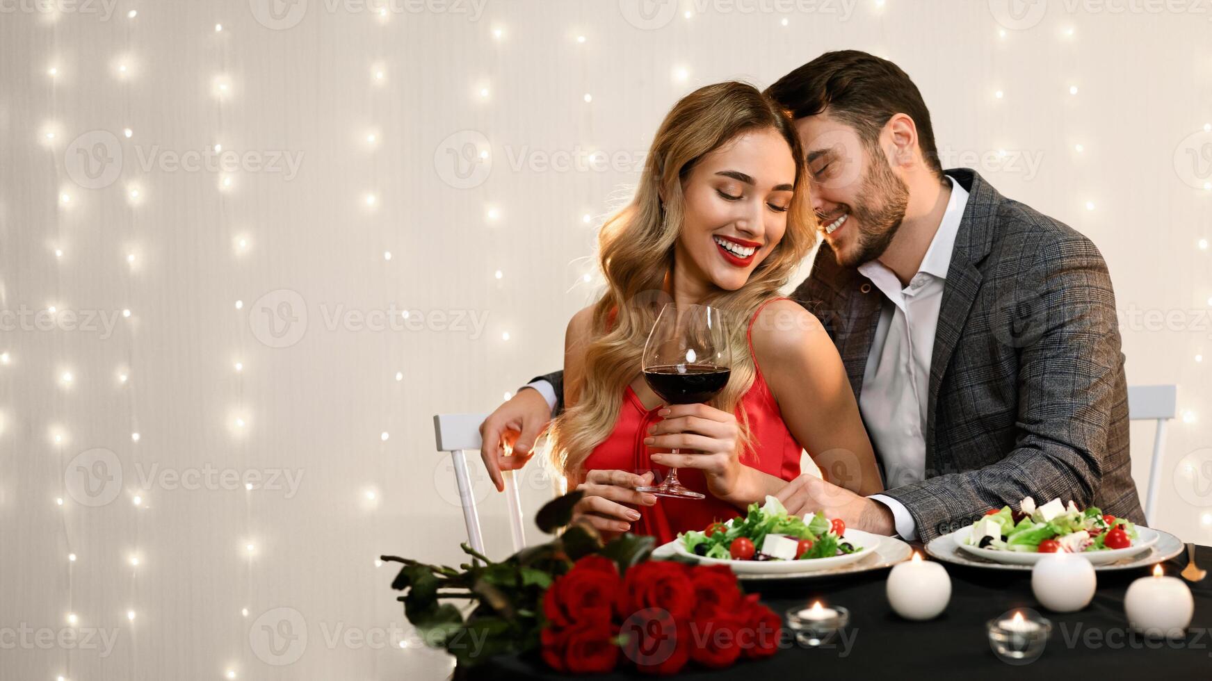 Passionate couple dining in restaurant, drinking wine and having romantic moments, free space photo