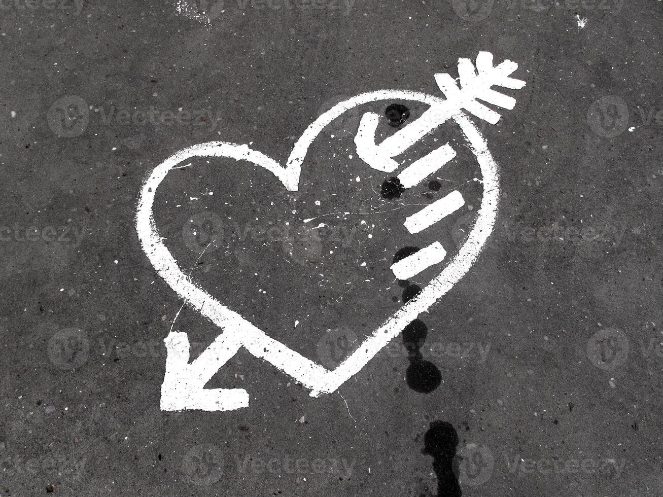 Abstract love symbol on pavement photo