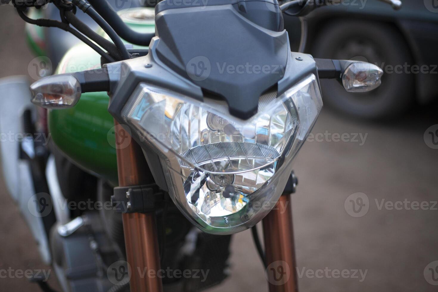 The motorcycle is in detail. Bike in the parking lot. Large Front Lamp. photo