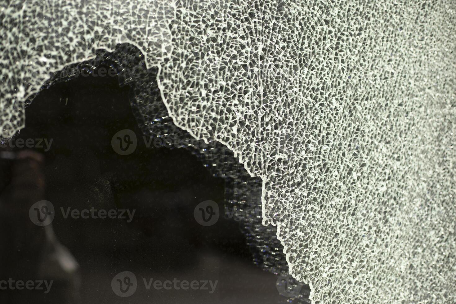 Broken glass. Cracks in the window. Many small cracks. photo