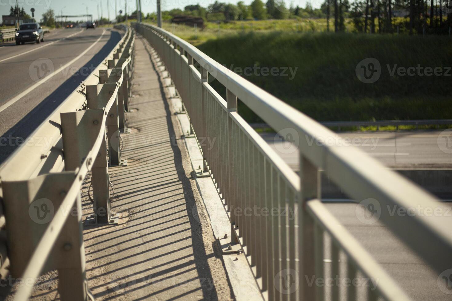 Passage over the bridge. Handrail at the bridge. Road. Roadside. photo