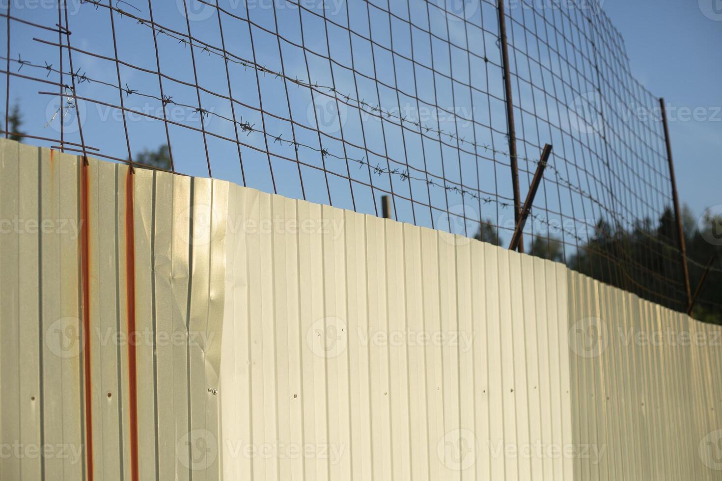 Steel fence around area. Stainless steel fence. Private territory. photo