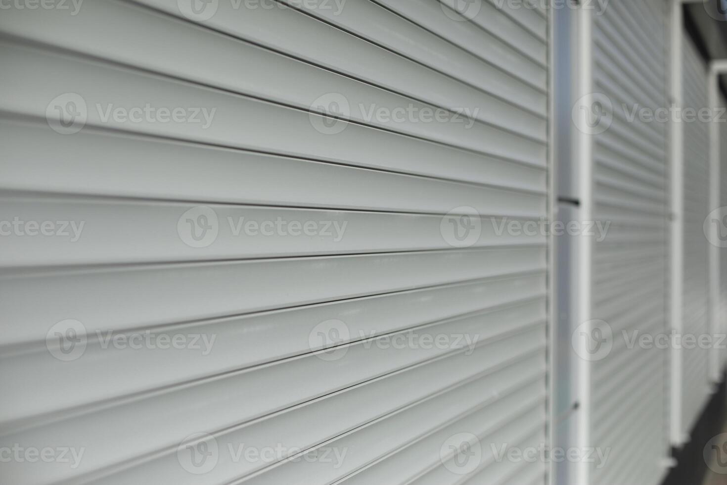 Blinds on window. Shutters on windows of office. Grey shutters. photo