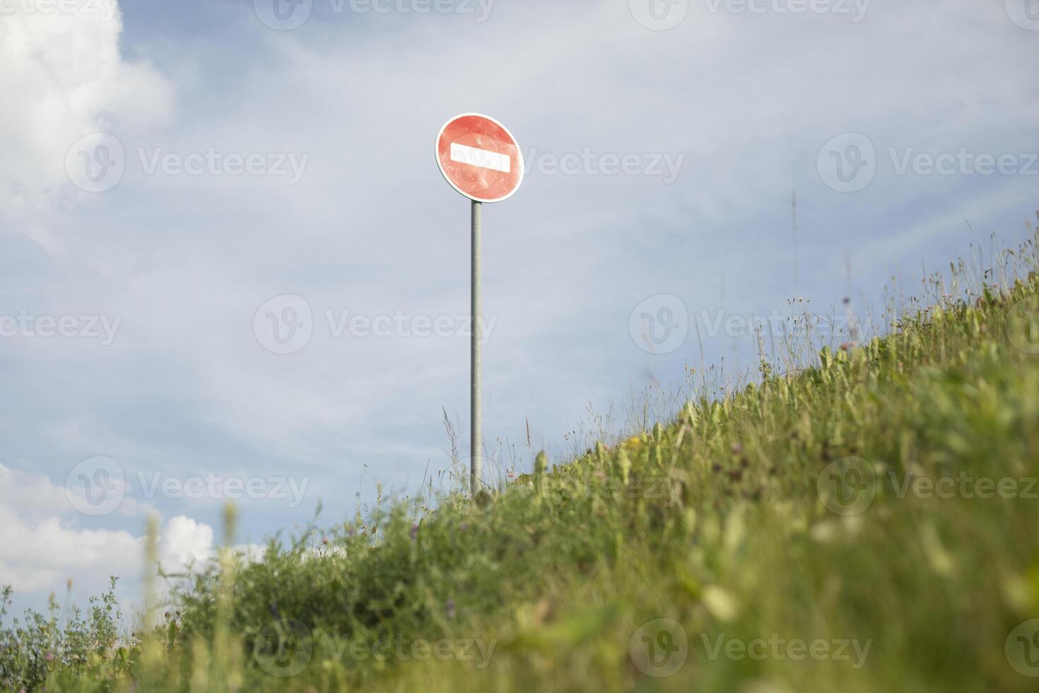 Stop sign on Green Mountain. Traffic Restriction Road Sign. Hill Pointer. photo