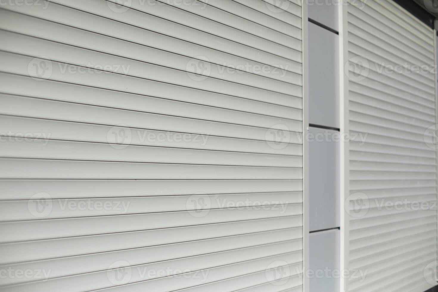 Blinds on window. Shutters on windows of office. Grey shutters. photo