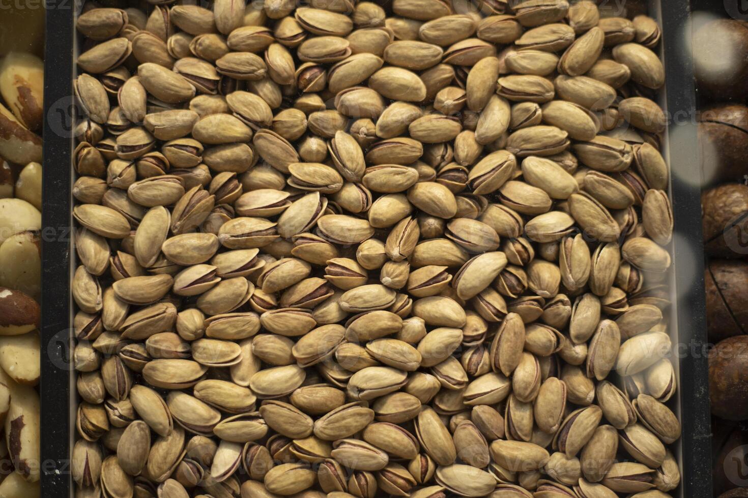Pistachio texture. Sale of nuts. Roasted pistachios. photo