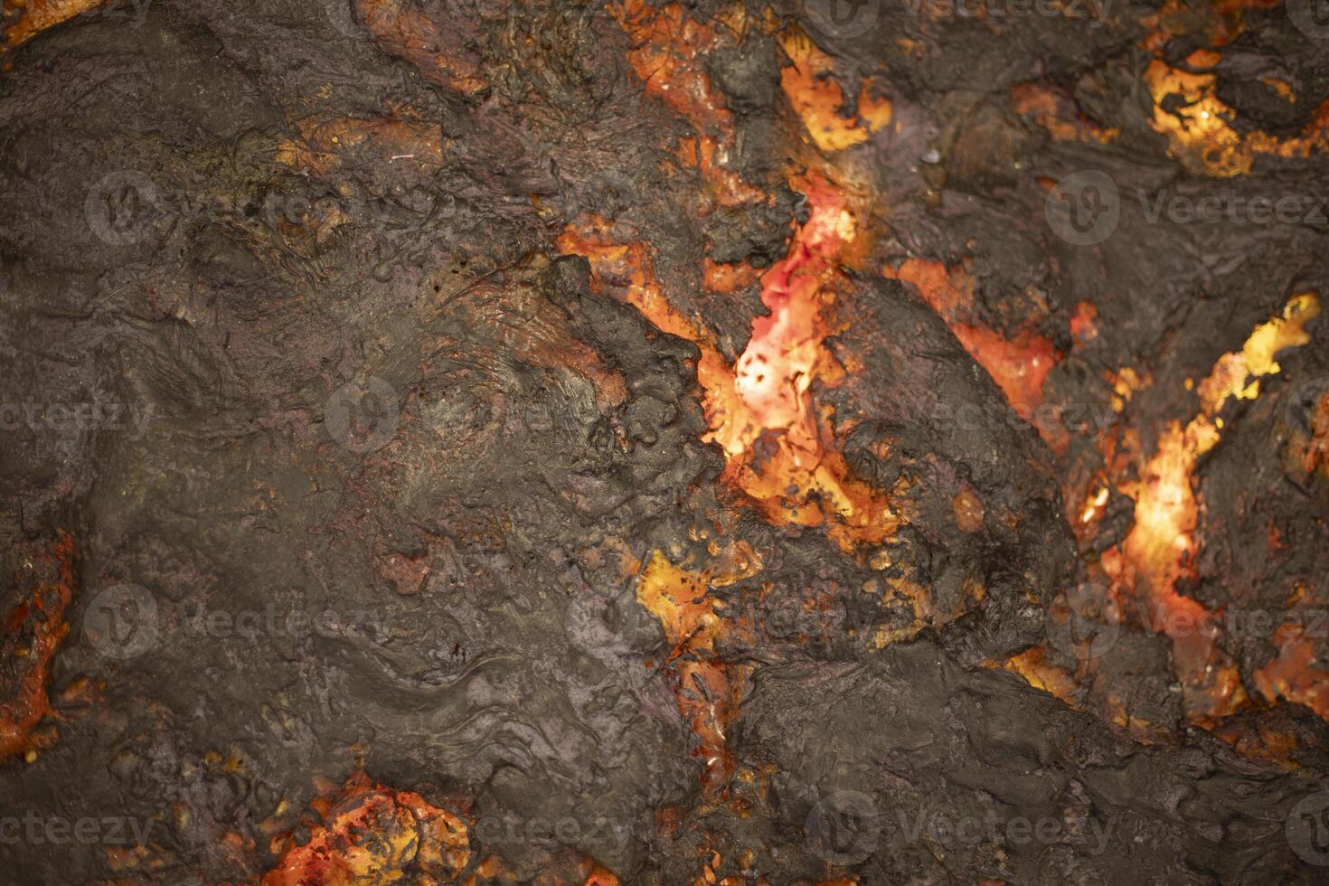 Fire lava. Hot stream. Lava flow. photo