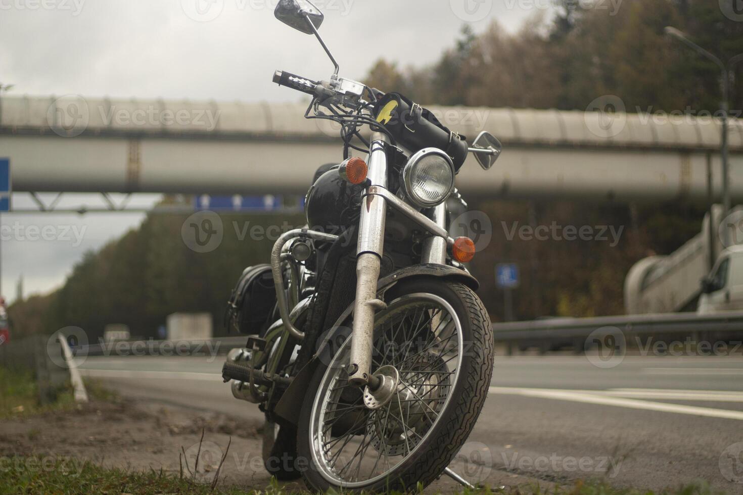 Motorcycle black color. Bike on the side of the road. Personal transport. photo