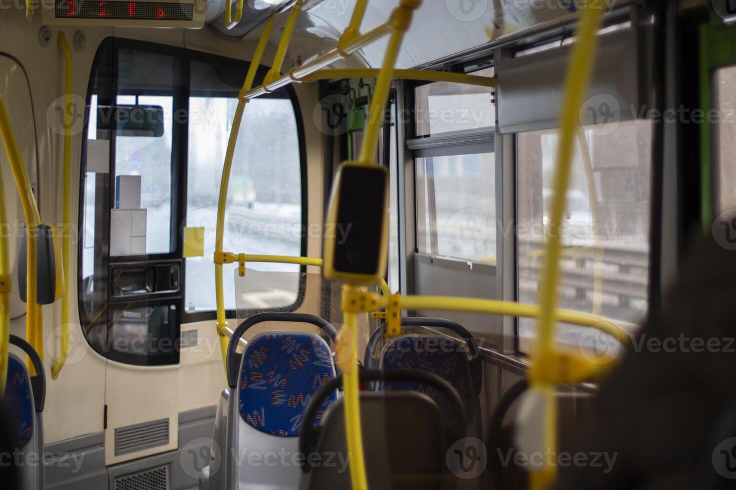 The interior of a modern bus. Public transport inside. Bus fare collection system. photo