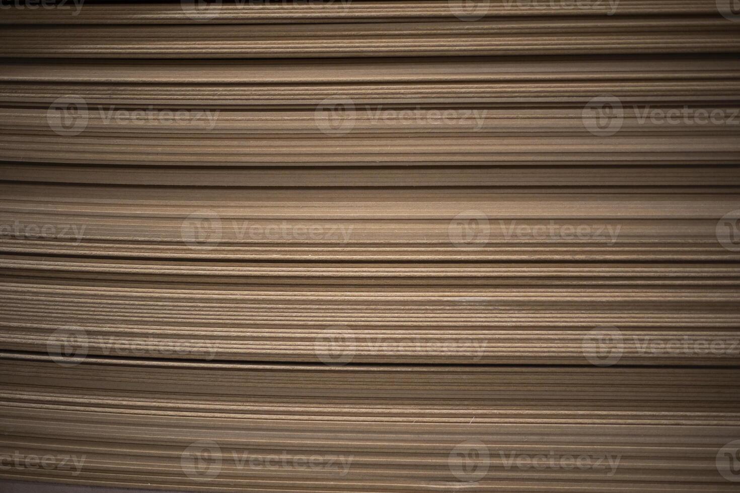 A stack of thin boards. Construction material. Product made from sawdust. photo