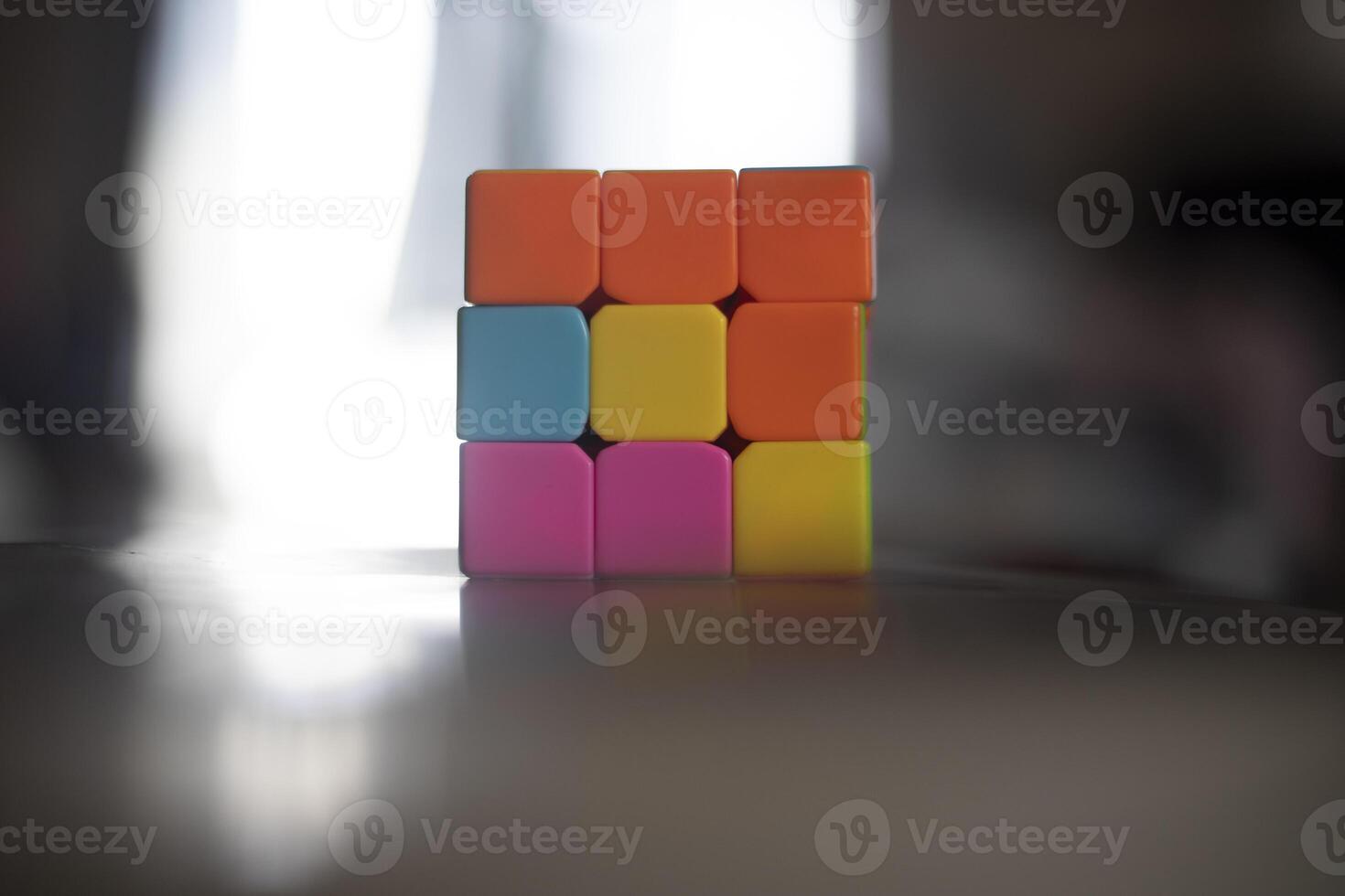 Intellectual game. Cube made of different colored tiles. A game for the mind. photo