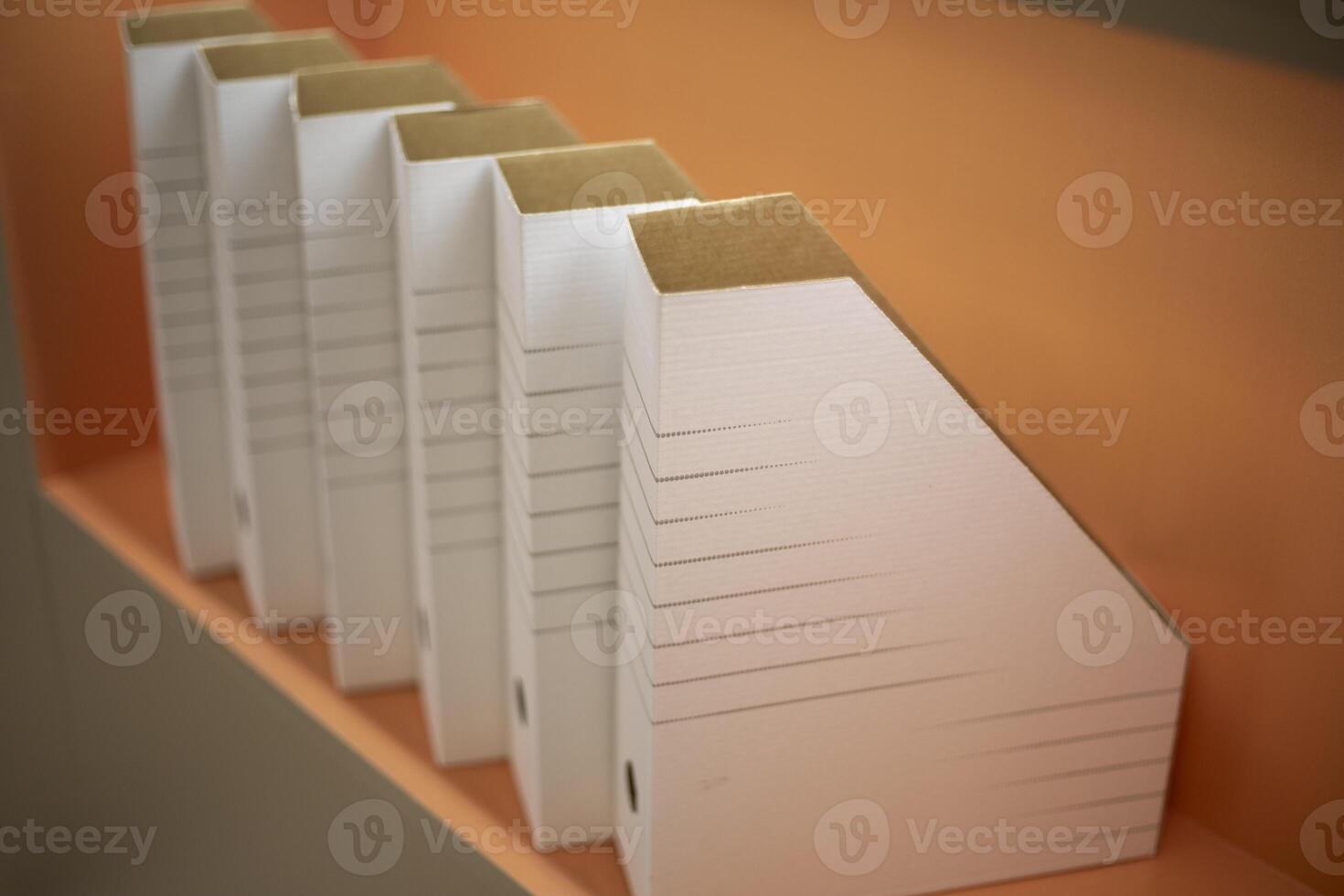 Empty folders stand in a row. A place to store documents. Folders on the shelf. photo