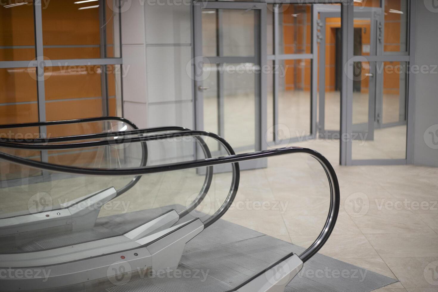 Escalator in the building. Interior of an office building. Elevator to floor. photo