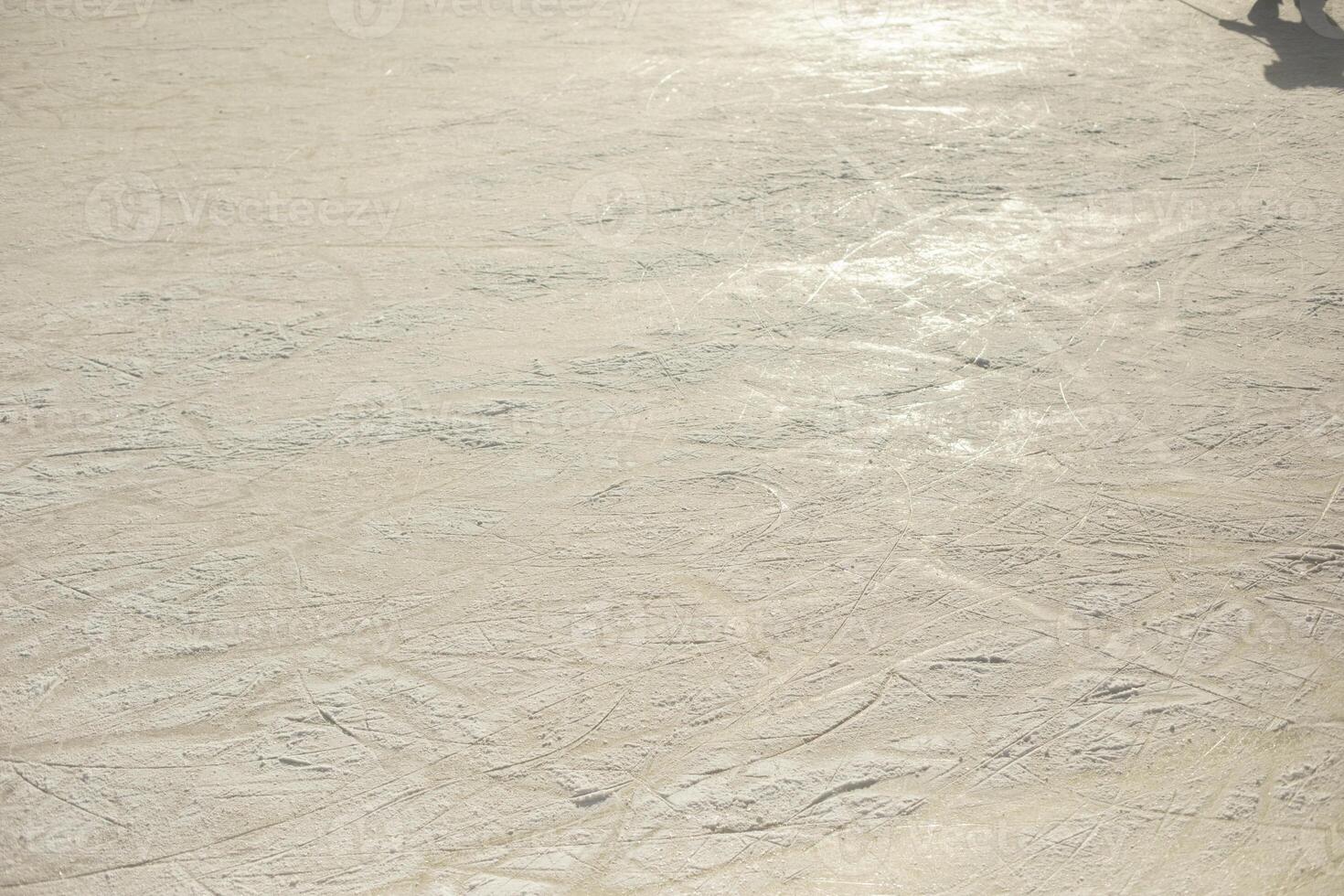 Ice texture in the stadium. Ice skating. Snow-covered surface. photo
