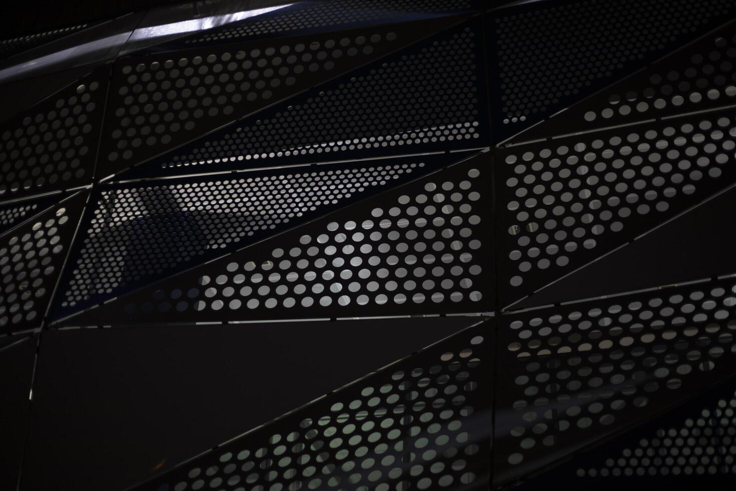 The building is at night. Modern architecture in detail. Steel Structure In Electric Light. photo