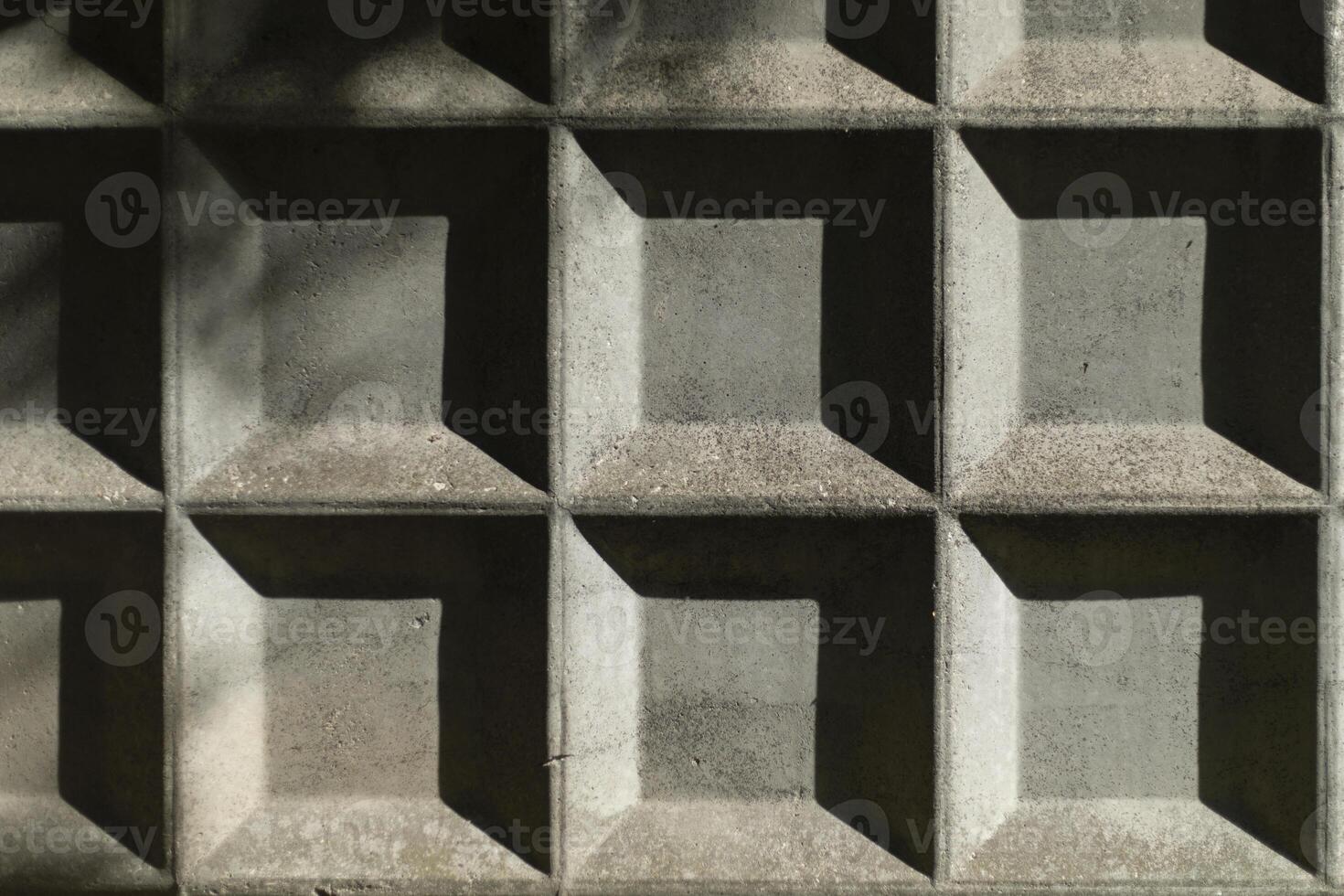 Concrete fence. A Structure of Squares. Fence in the sunlight. photo