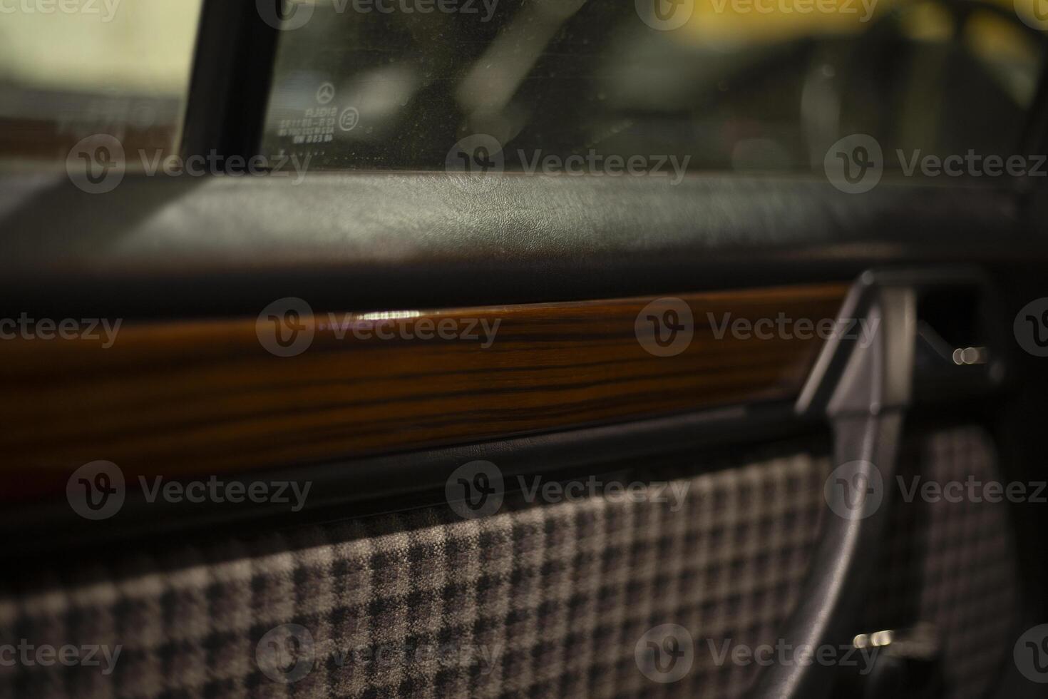 Car door upholstery. Wooden panel on the door. Fabric Upholstery Machine. photo