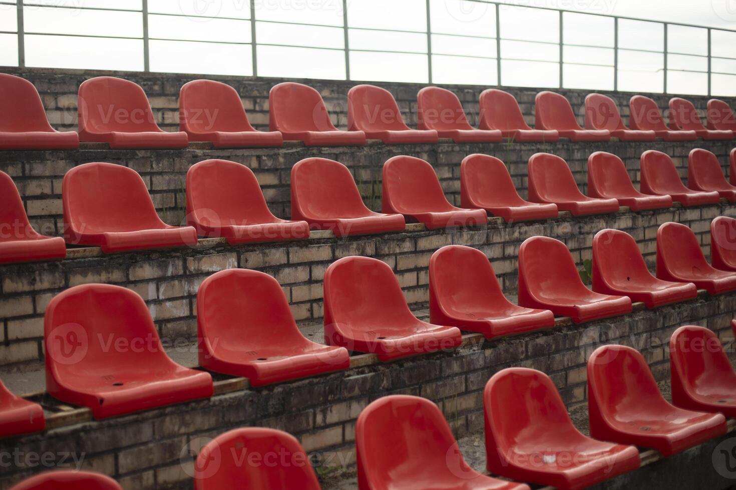 Sports stand. Empty seats in the stadium. Chairs in the stadium. photo
