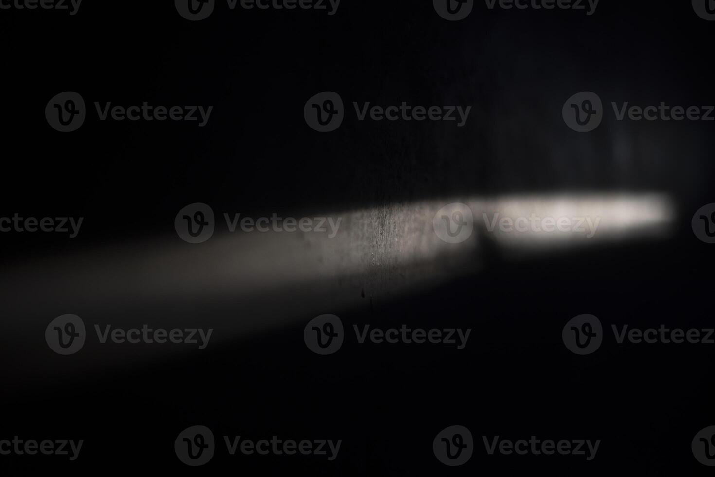 Line of light on the wall. Beam on the surface. Light and shadow. photo
