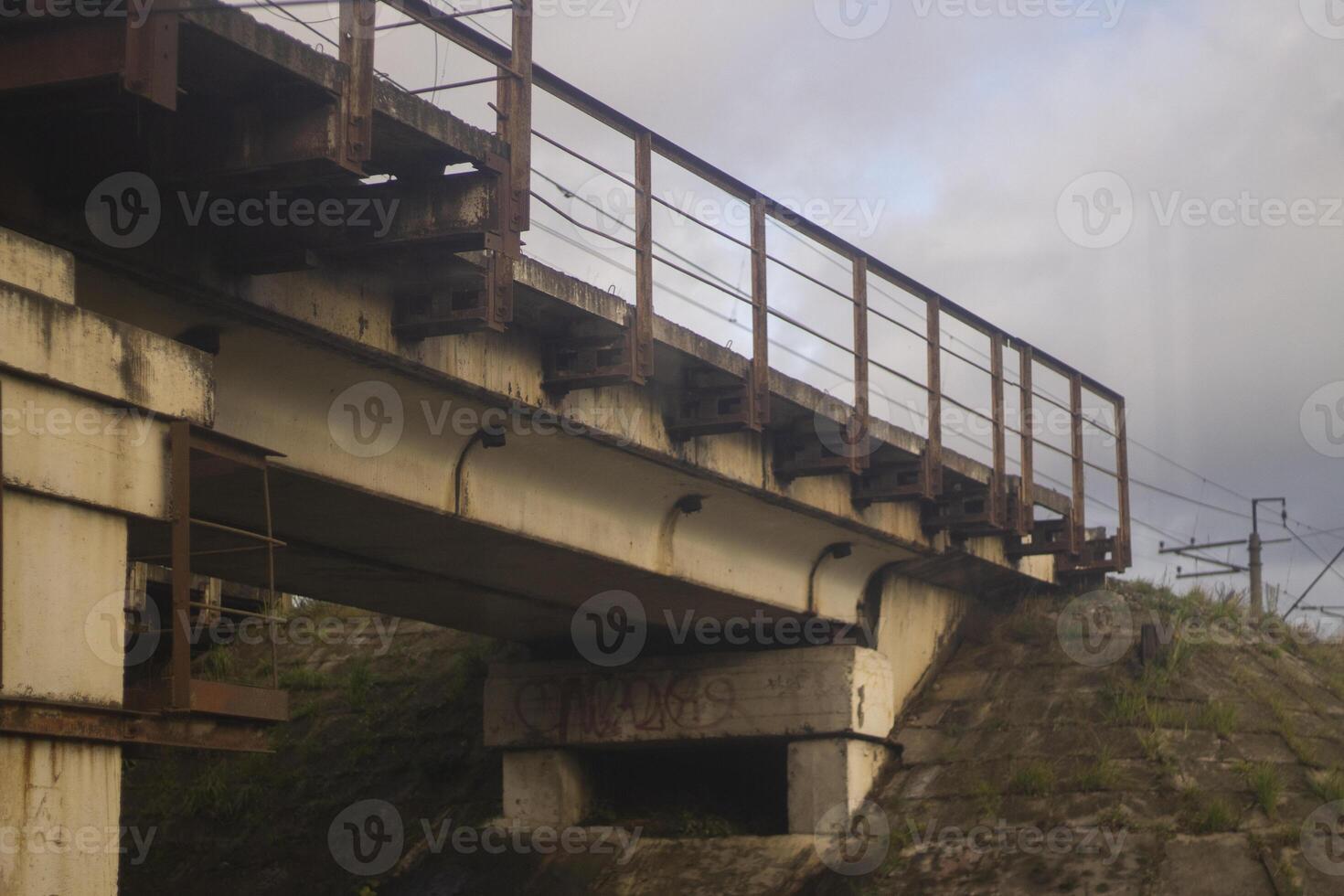 Railway bridge over the highway. Concrete bridge with railway tracks. Transport architecture. photo