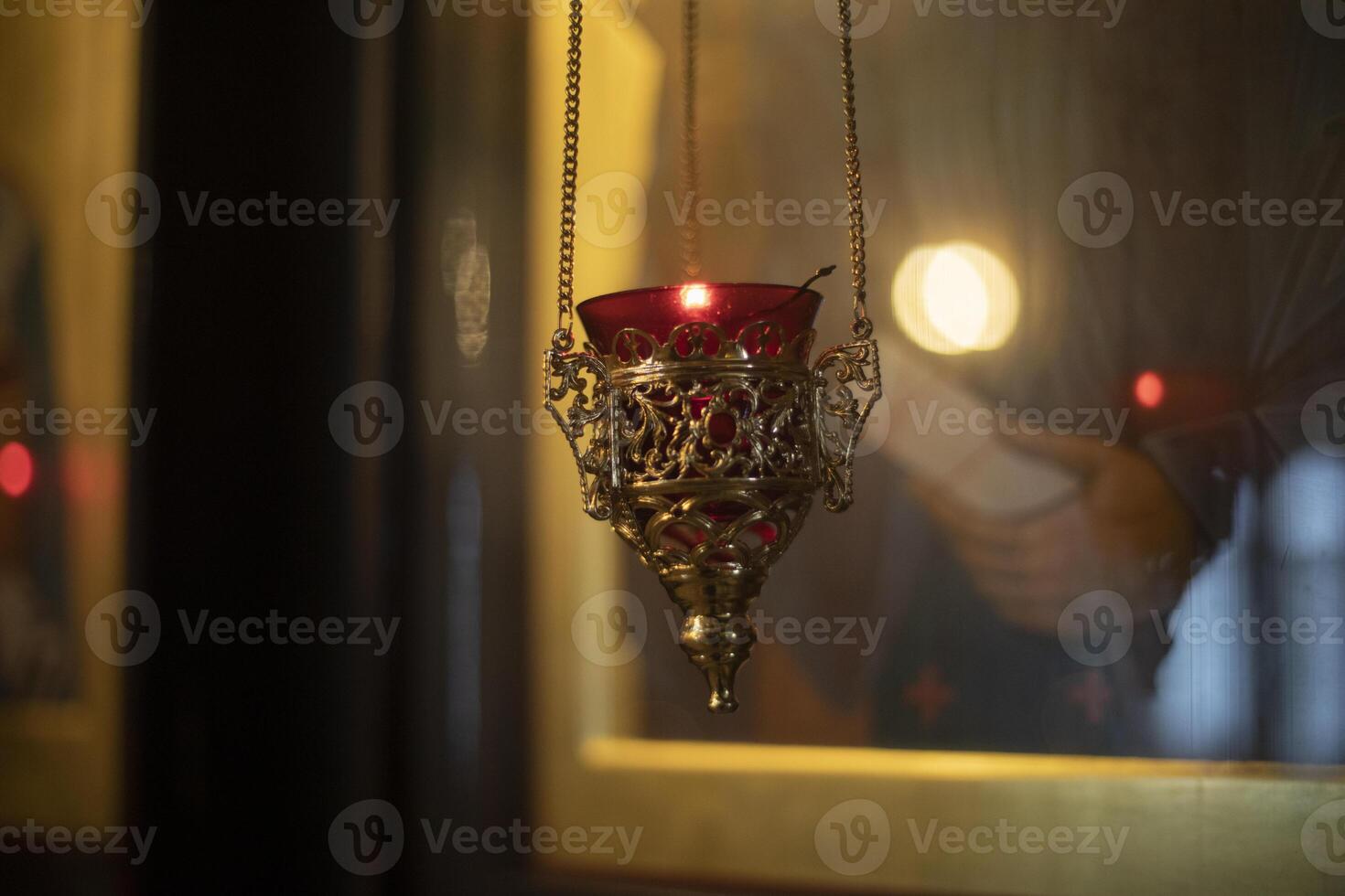 Lamp in the Temple. Ecclesiastical subject. Candle lamp. photo