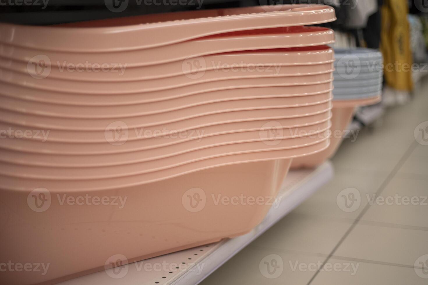 Plastic bath for a child. Sale of goods for children. Children's department in the store. photo