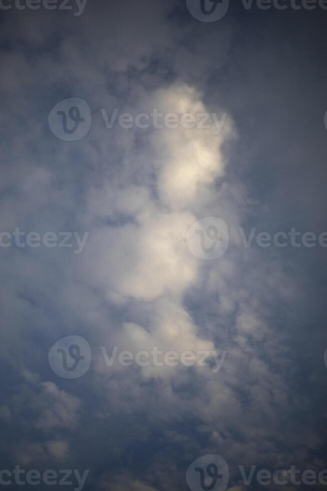 Clouds in the sky. Vertical shot of clouds. Air space. photo