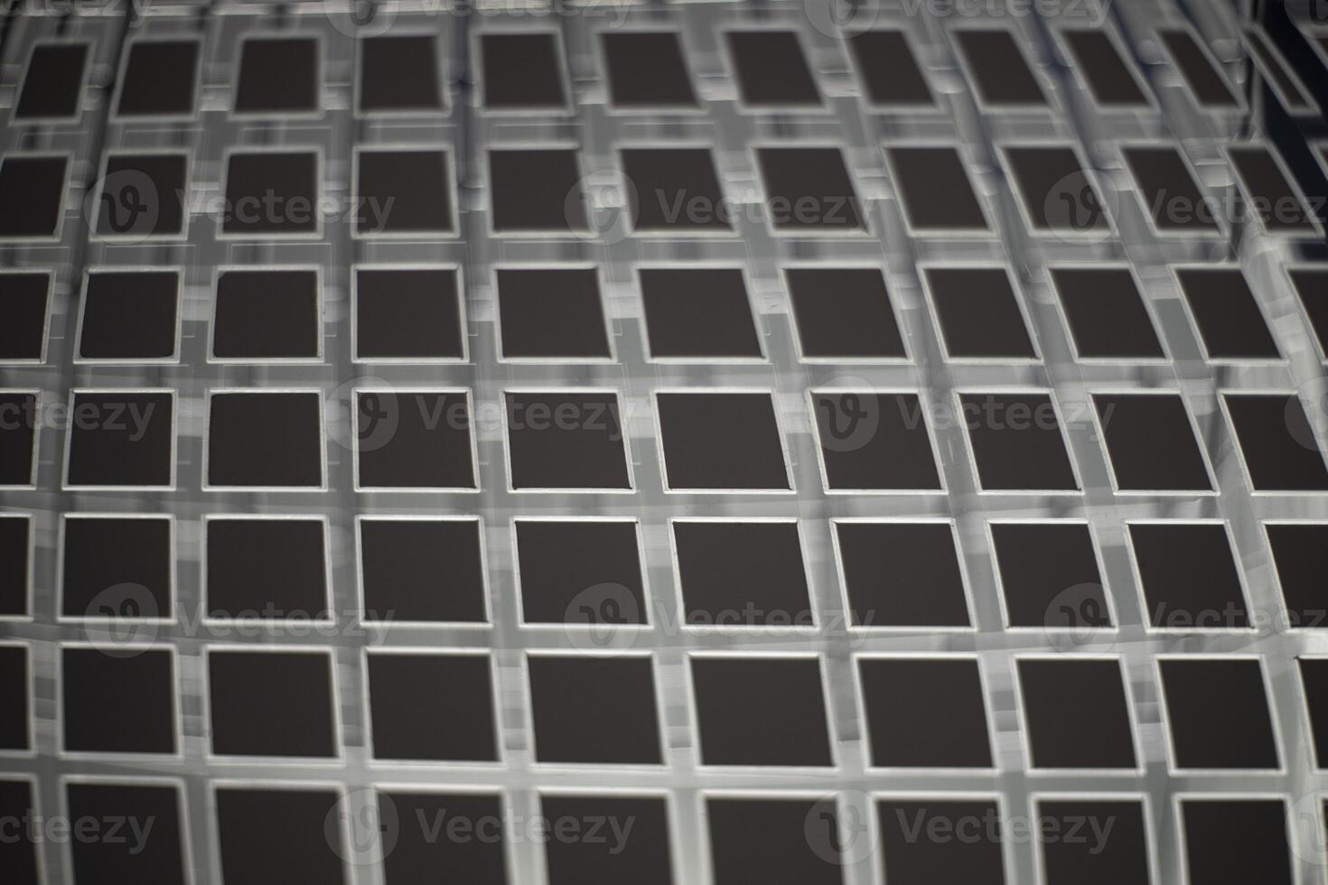 Steel mesh. Metal mesh of uneven lines. Square texture. photo