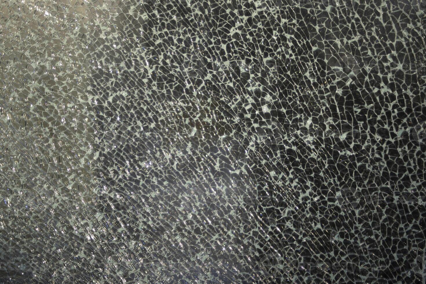 Shards of glass. Crack on the window. Fine mesh of cracks. photo