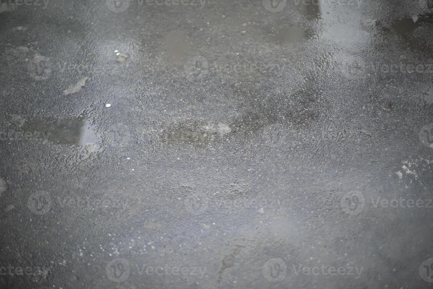 The texture of asphalt. Wet asphalt. Details of the road. photo