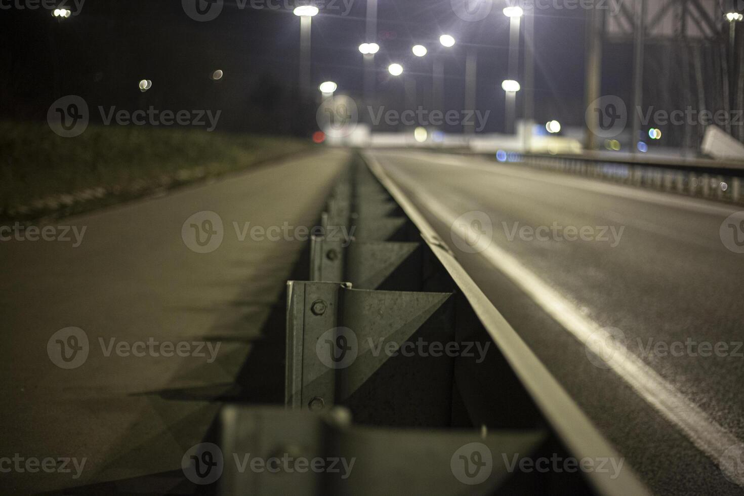 Obstacle from the car. Chipper on the road. Night track. photo