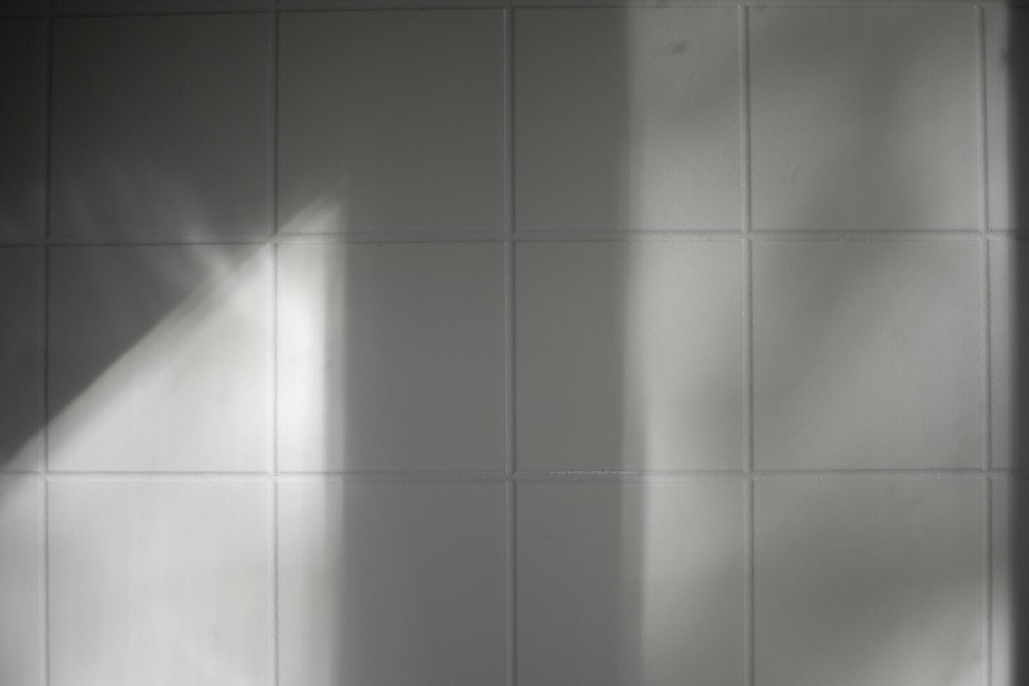 Light on the wall. Shadow in the room. Kael tiles in the kitchen. photo