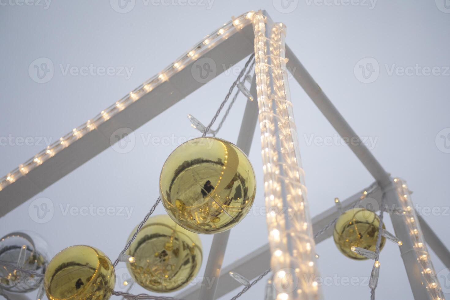 Garlands for the New Year. Balls on the structure. Decoration of the city. photo