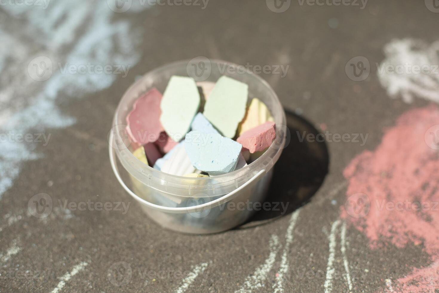 Crayons for drawing on asphalt. Children's drawing. Crayons of different colors. photo