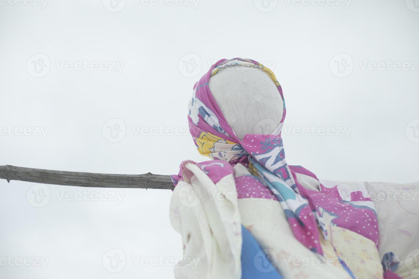 Symbol of spring in Russia. Pagan symbol of winter. Rag doll. Burning doll. photo