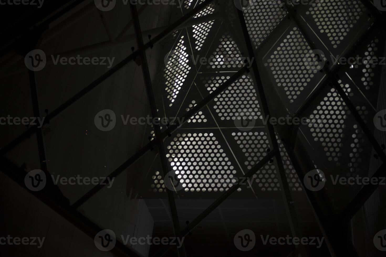The building is at night. Modern architecture in detail. Steel Structure In Electric Light. photo