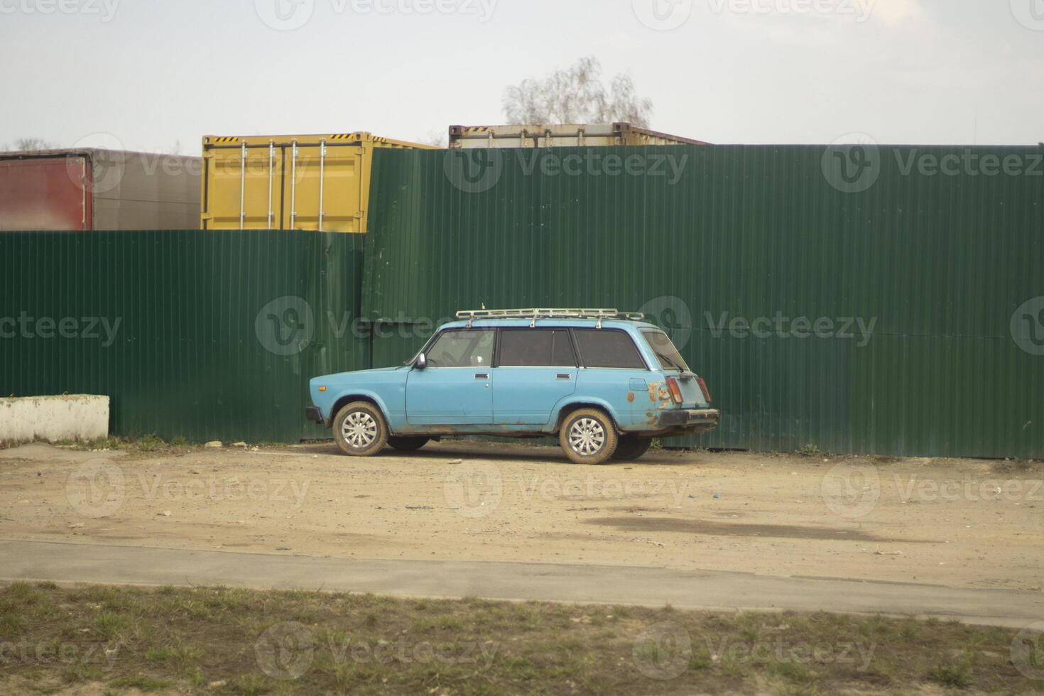 A car in a parking lot in the city. Transport in the yard. A parked car on the street. photo