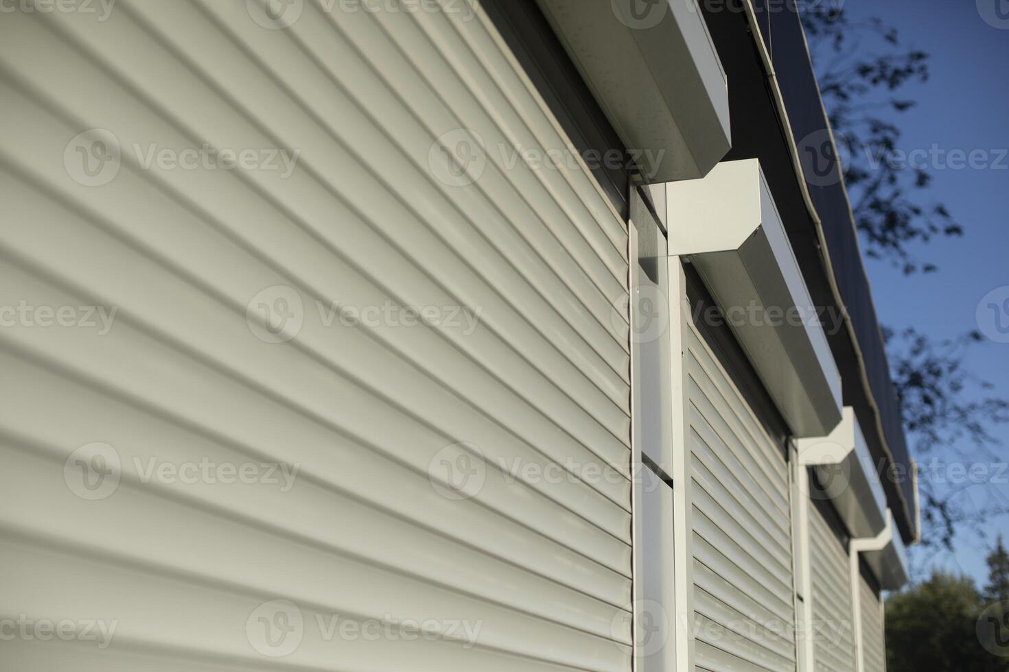 Blinds on the windows. Shutters on large windows. Plastic shutters on display case. photo