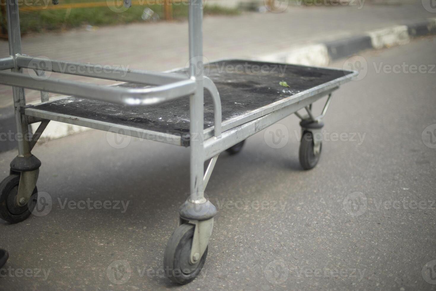 Cart for transporting rounds. Steel cart on wheels. Means of transportation. photo