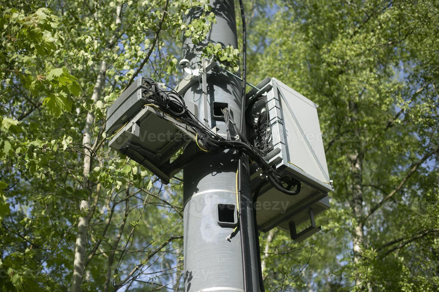 Equipment on pole. Internet transmitter. Electrical equipment on street. photo