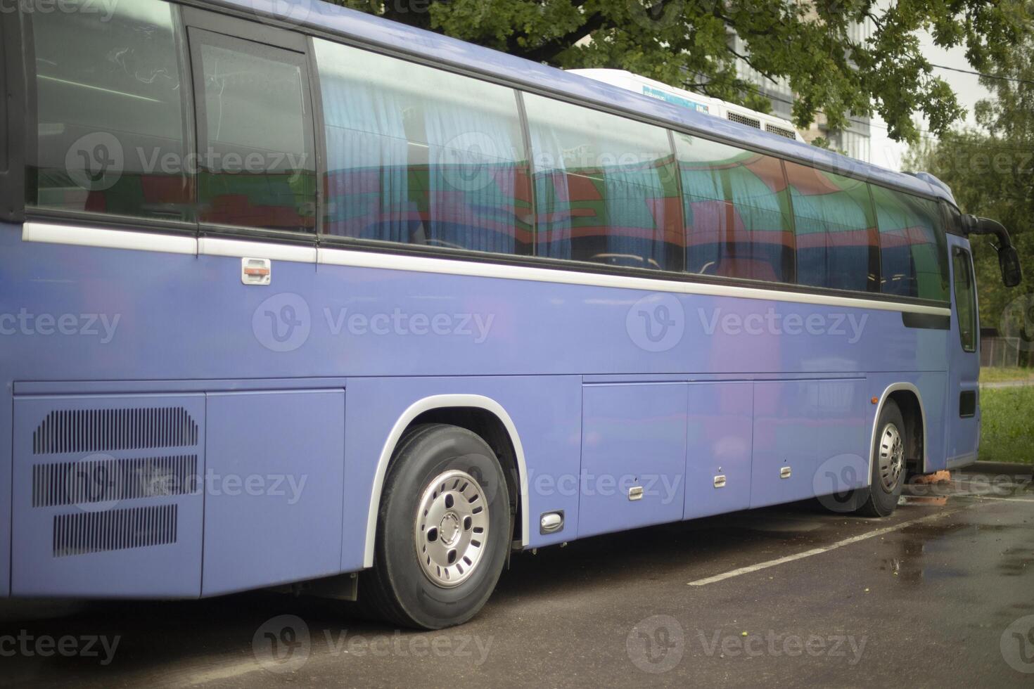 Blue bus in parking lot. Regular bus in fleet. Public transport. photo