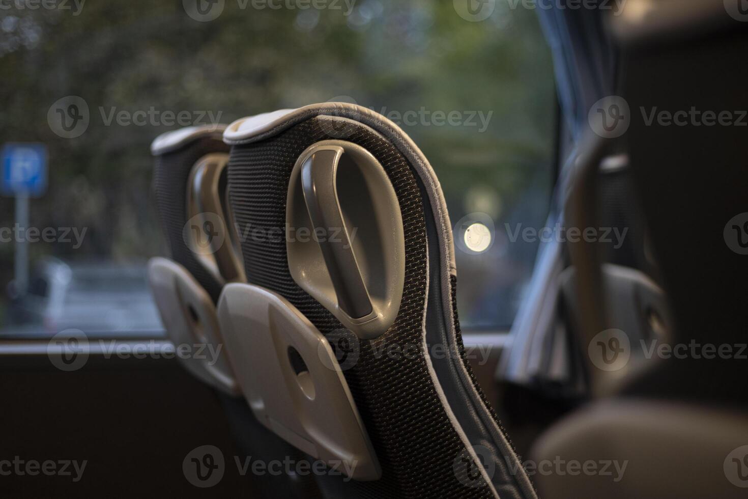 The interior of the bus. Seats inside the transport. Empty seats in the bus cabin. photo