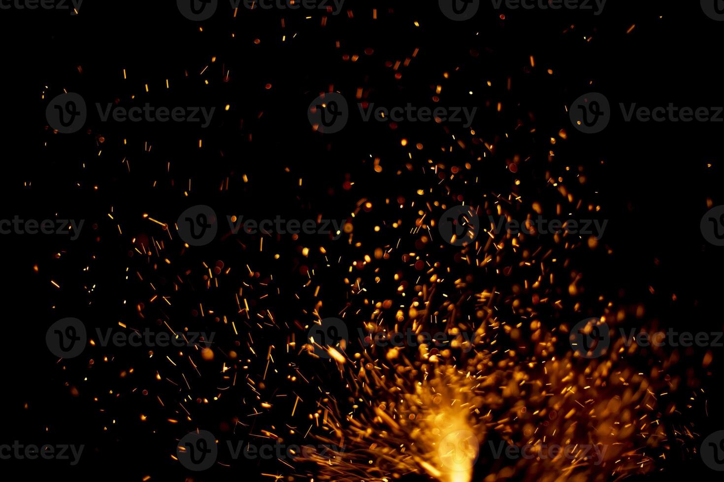 The texture of the fire. Sparks in the dark. Flames on a black background. photo