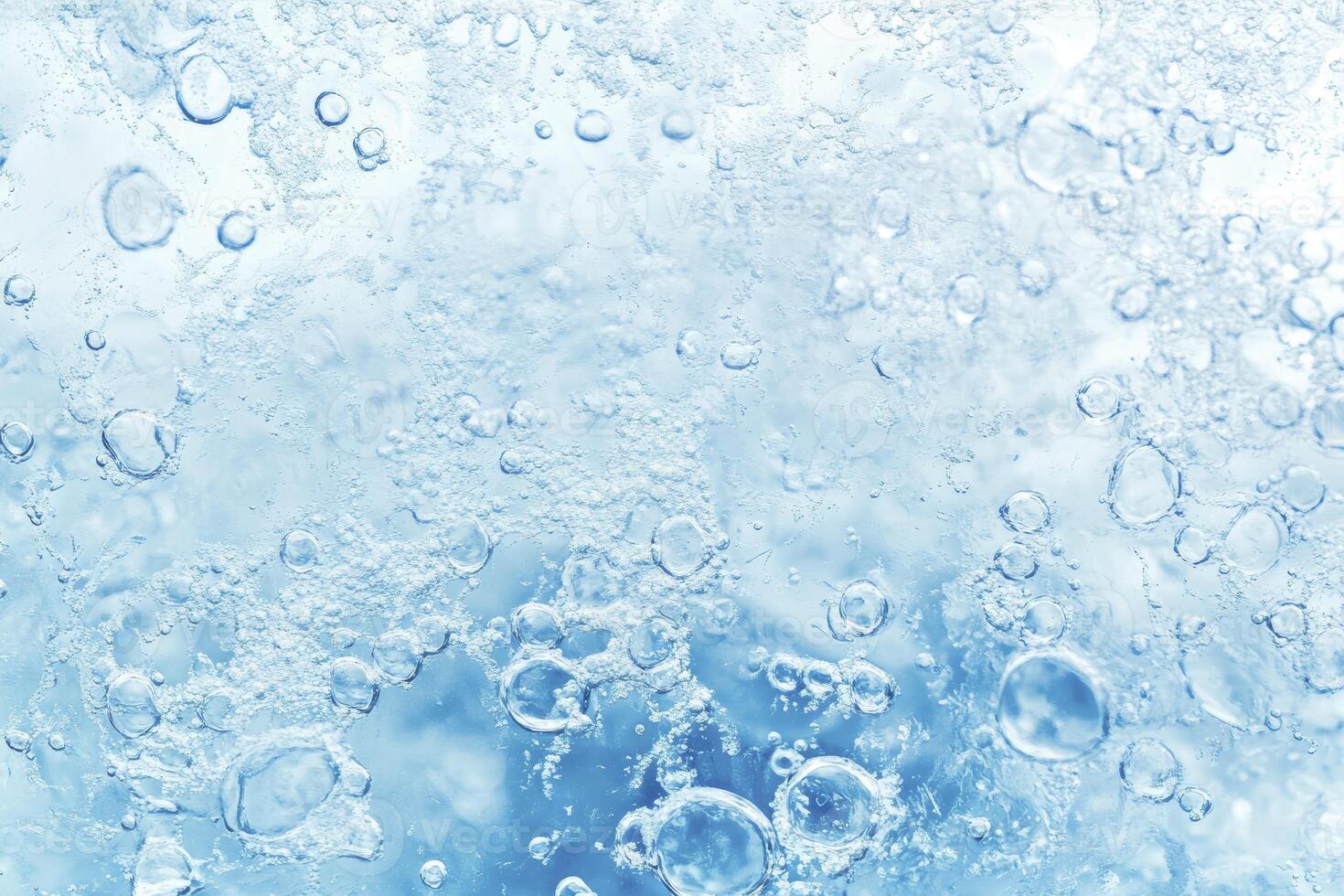 Water bubbles on a blue background photo