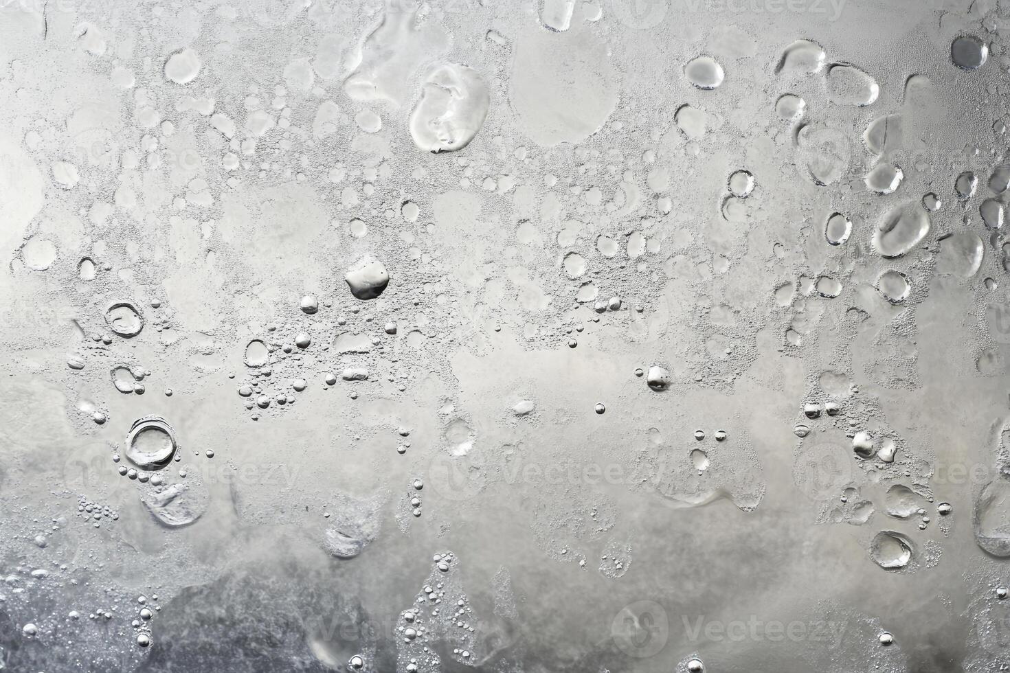 A close up of a window with water droplets on it photo